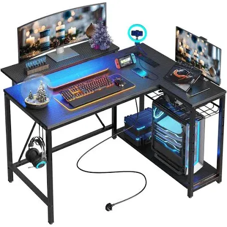 Bestier Small L Shaped Desk with Charging Port & LED Strip,Modern Computer Desk with Reversible Storage Shelves,Corner Desk with Hooks for Bedroom